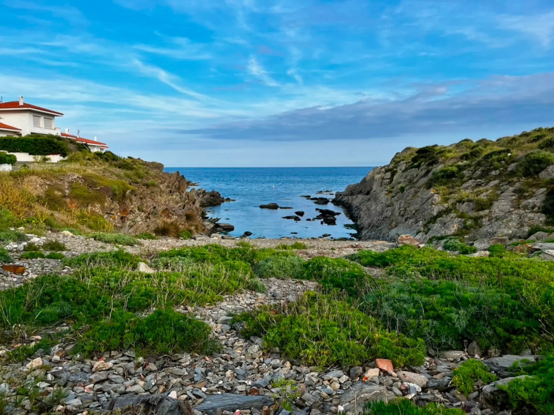 Wild rocky cove at Racó d'en Senès with Mediterranean vegetation, Cadaqués